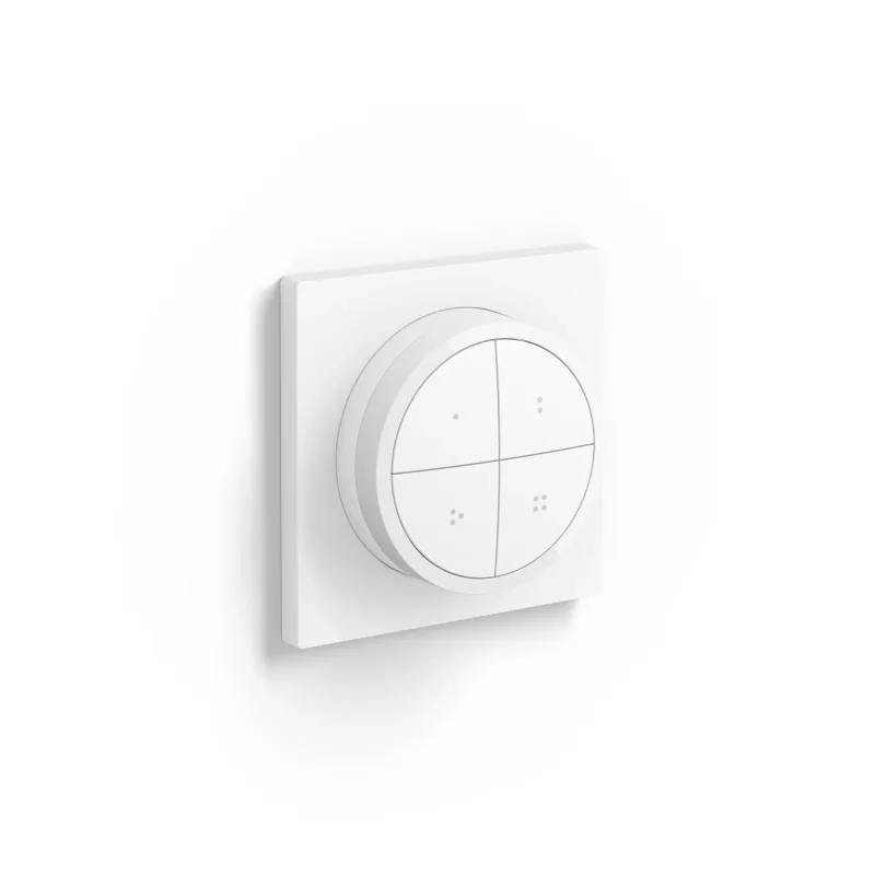 Witte Philips Hue Tap Dial Switch met vier knoppen en een draairing op een wandplaat