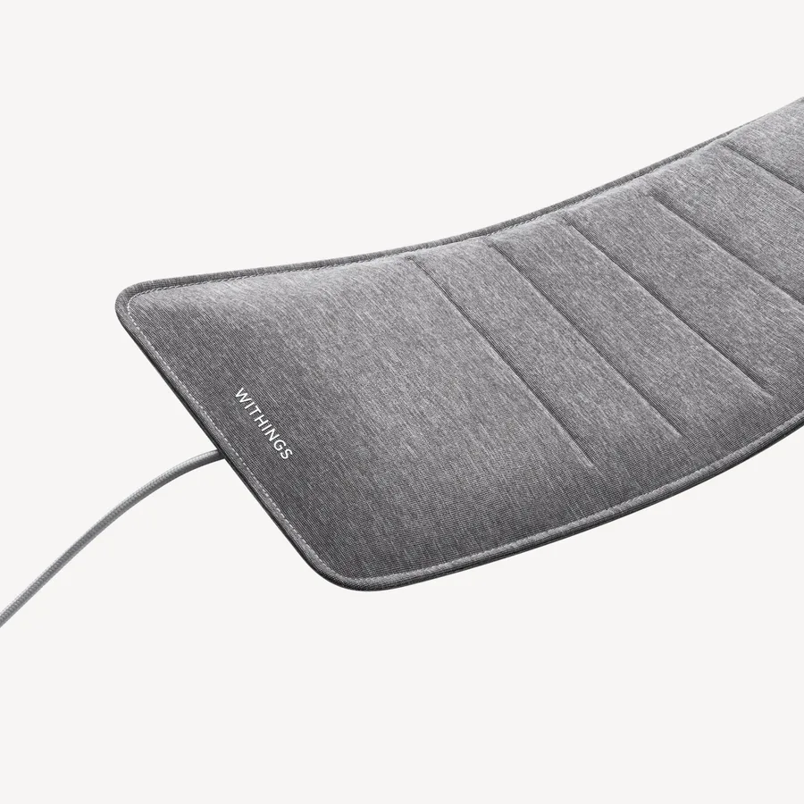 Withings Sleep Analyzer: grijze slaapmat met Withings-logo en kabel